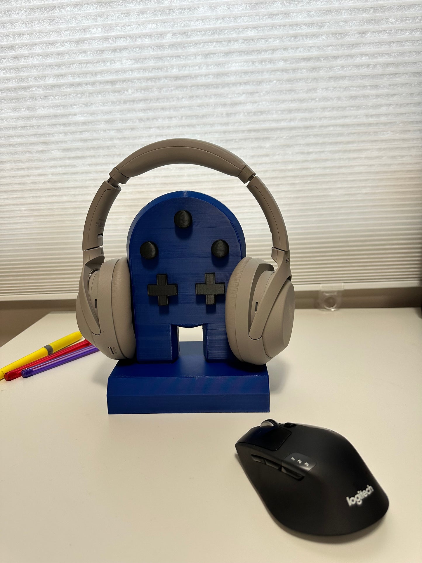 Retro gaming headset stand with buttons and base, perfect for gamers