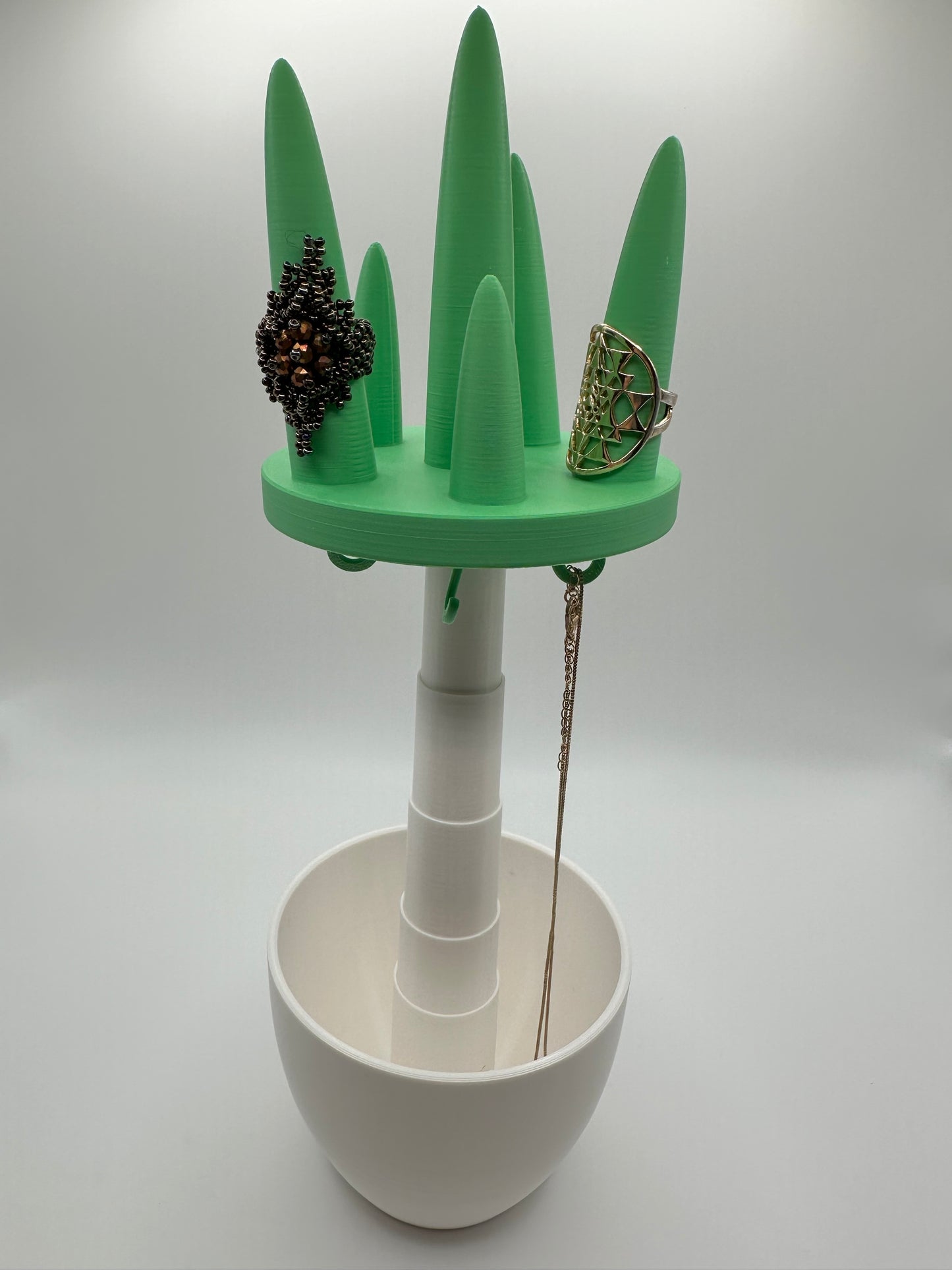 Modular jewelry organizer open with rings and necklace