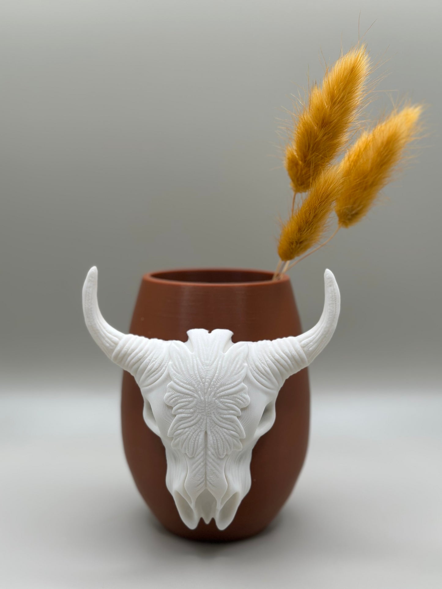 Close-up of white sculpted bull skull detail