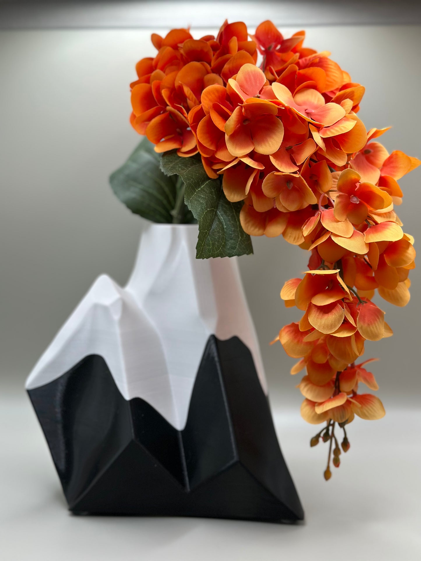 3D printed mountain-shaped vase in black and white