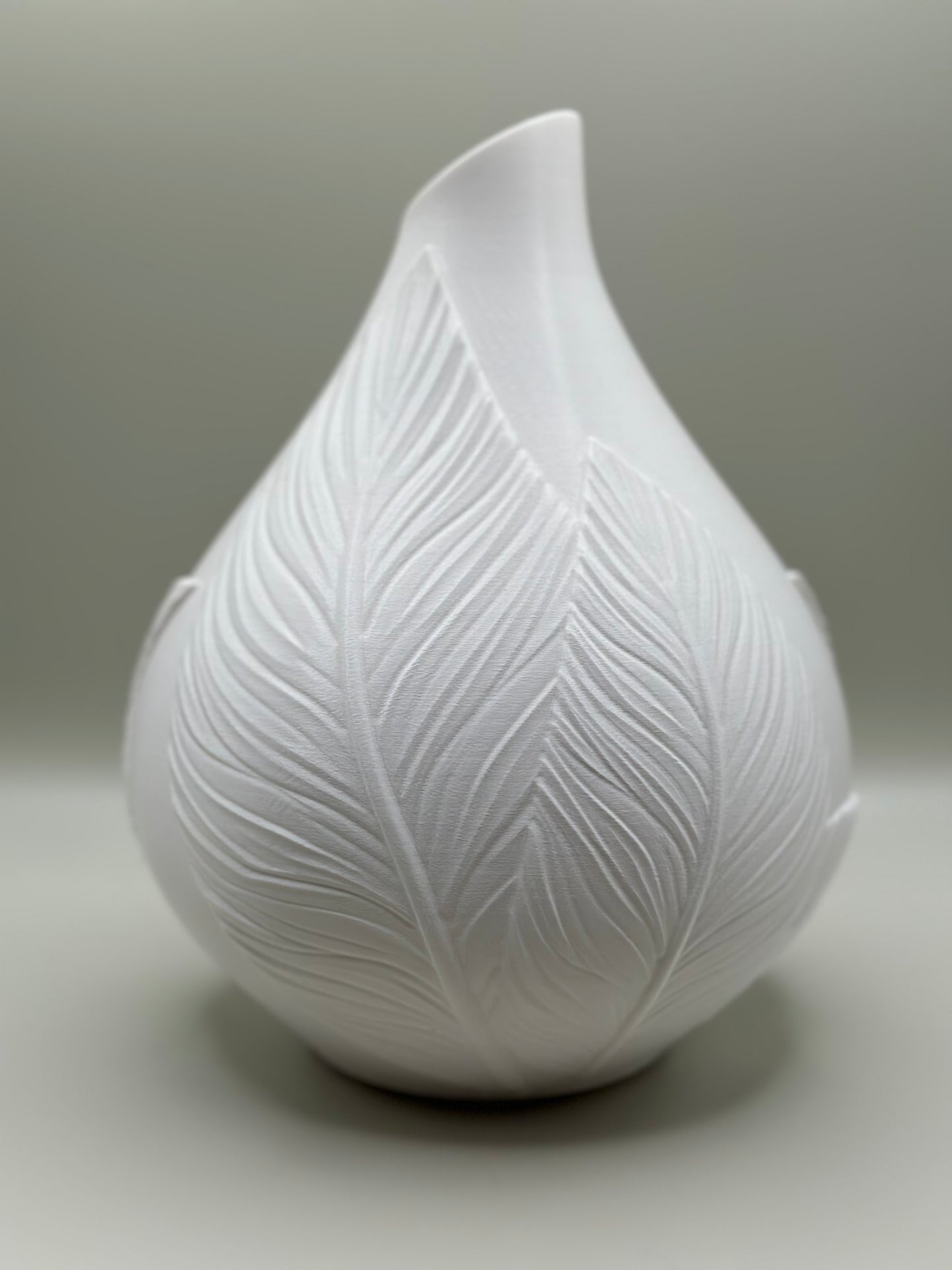 3D printed cream vase with raised leaf wrap design