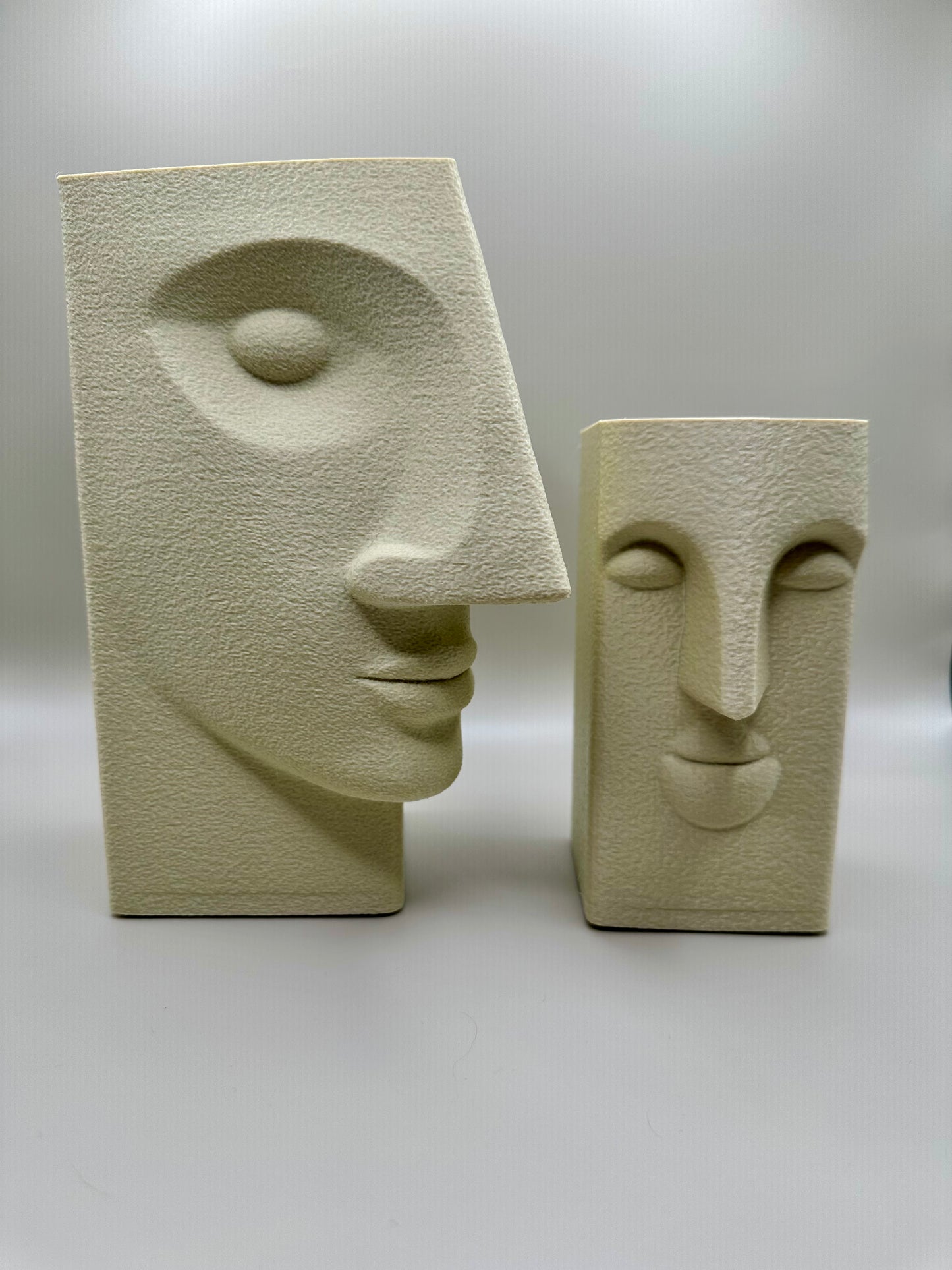 Set of 2 white abstract face sculptures