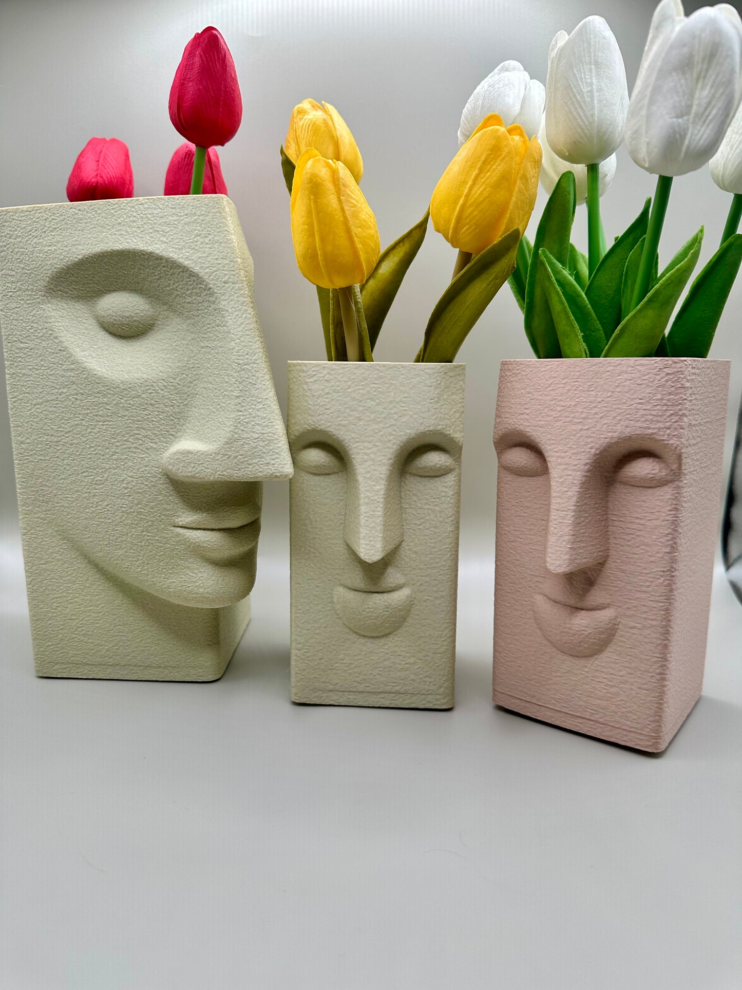 Modern abstract face sculptures in textured matte finish