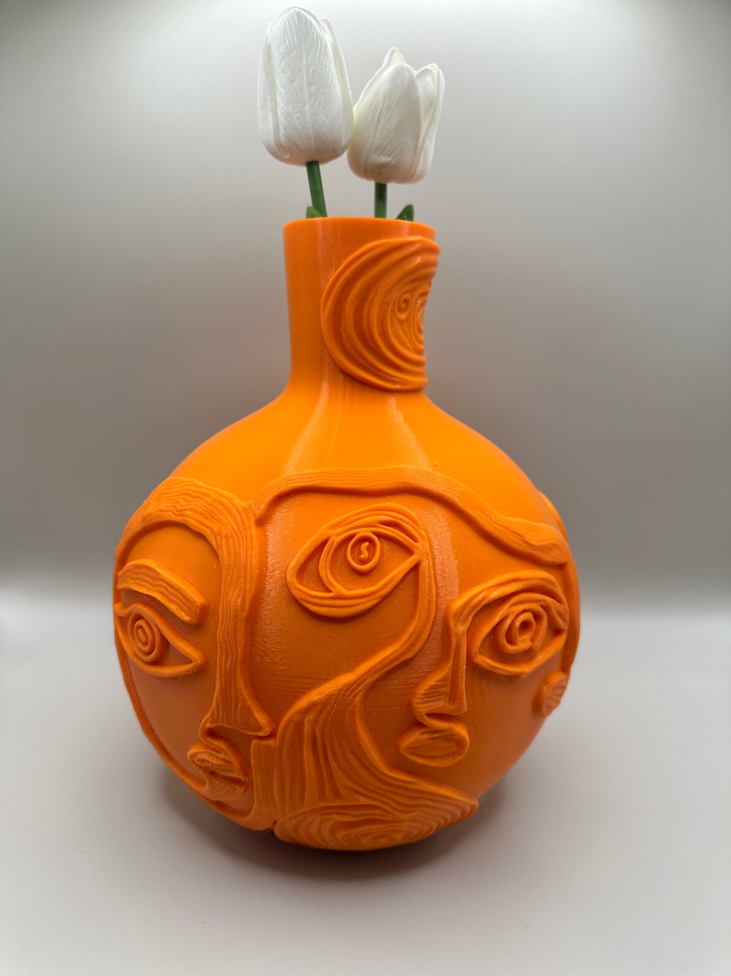 Beautiful orange faces vase