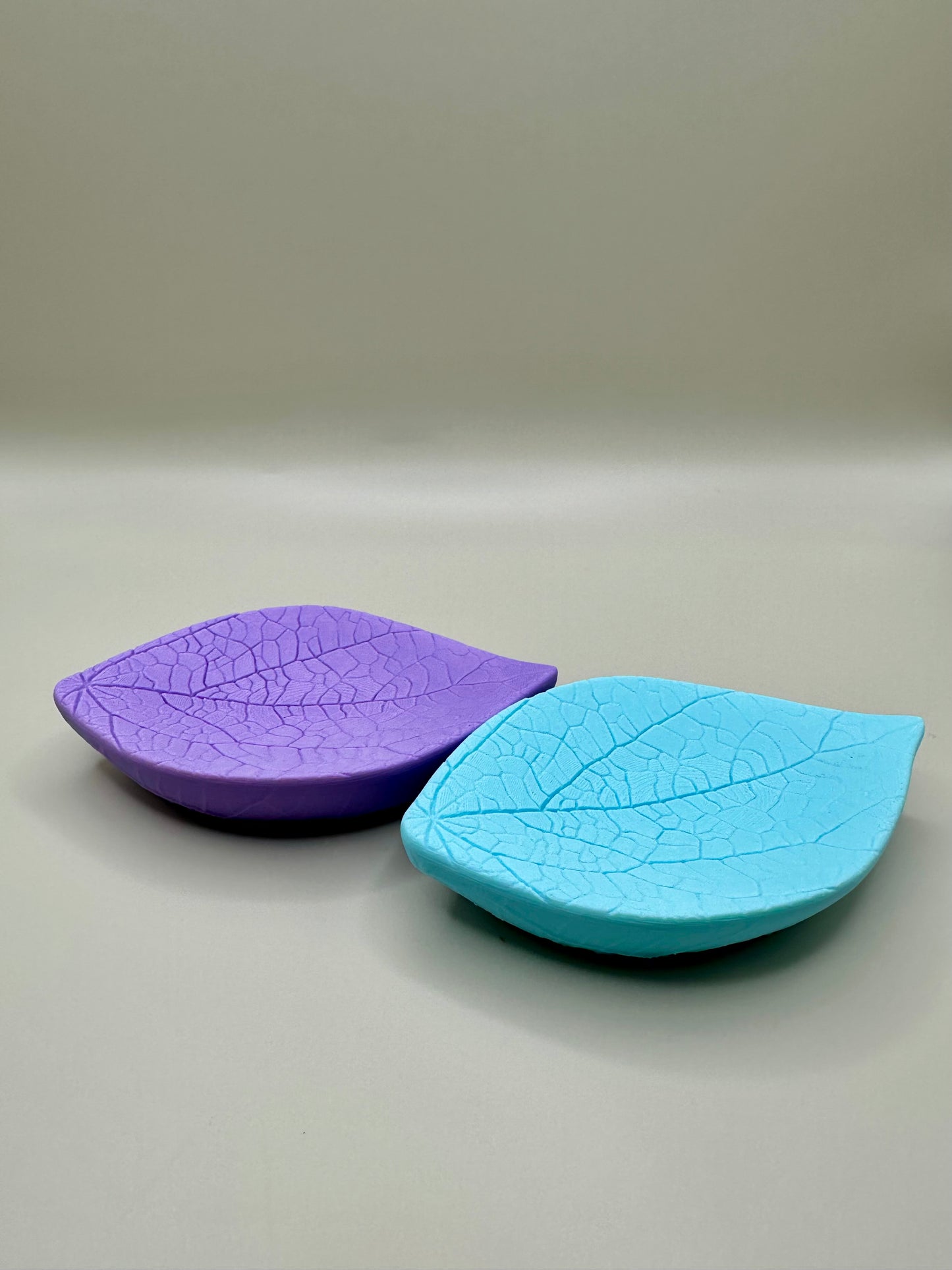 Purple and blue 3D printed leaf-shaped soap dishes