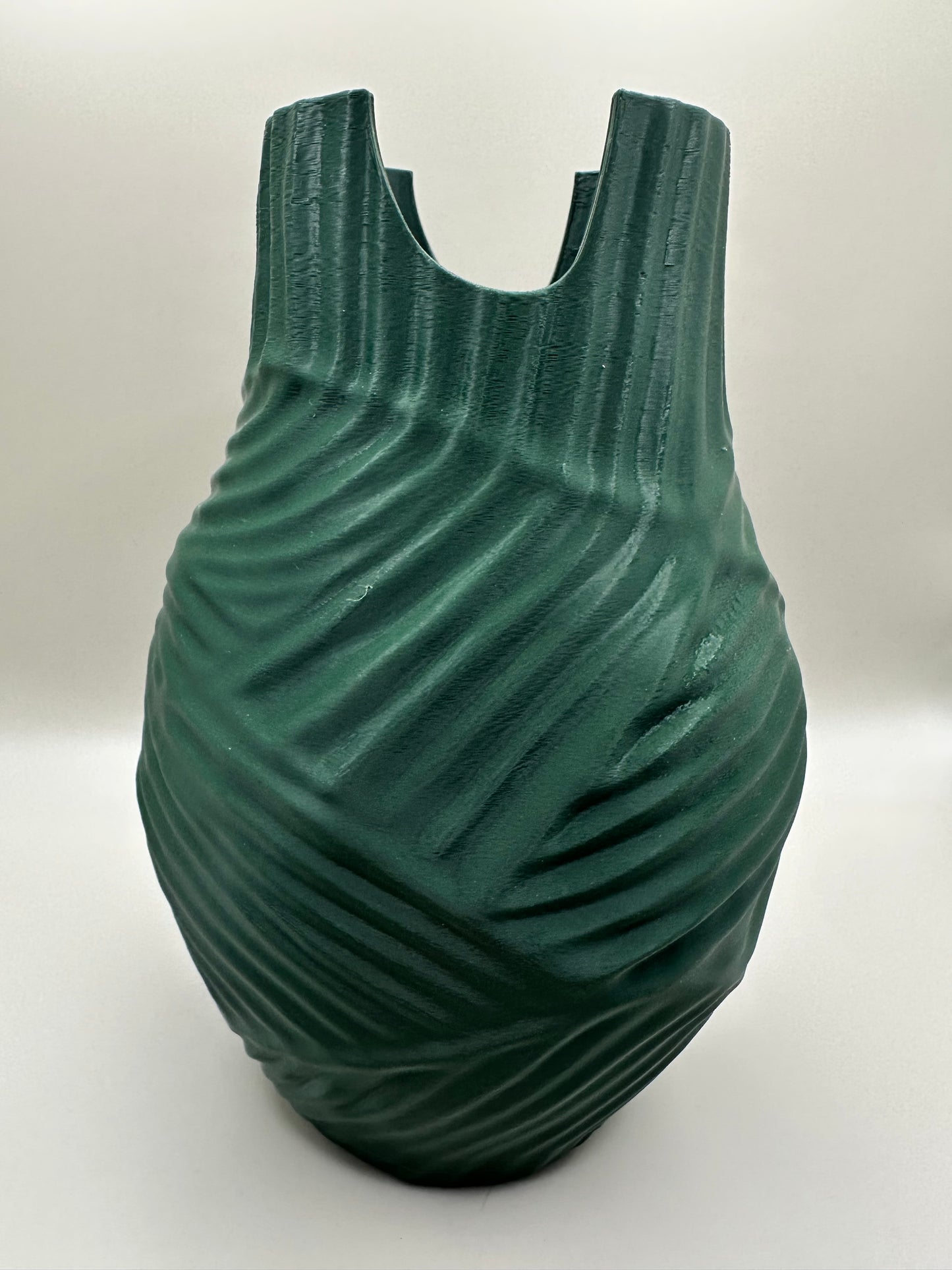 Close-up of sculptural vase with modern textured pattern