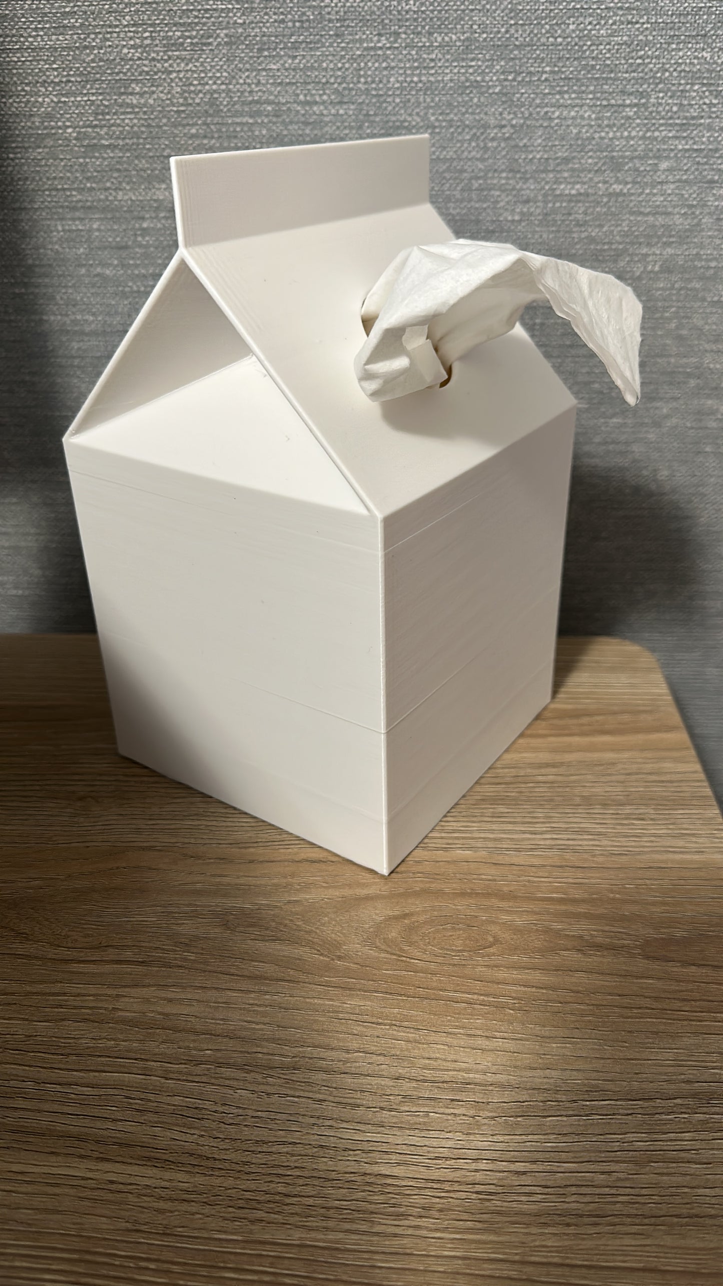 3D printed quirky tissue box inspired by a classic milk box design for creative spaces.