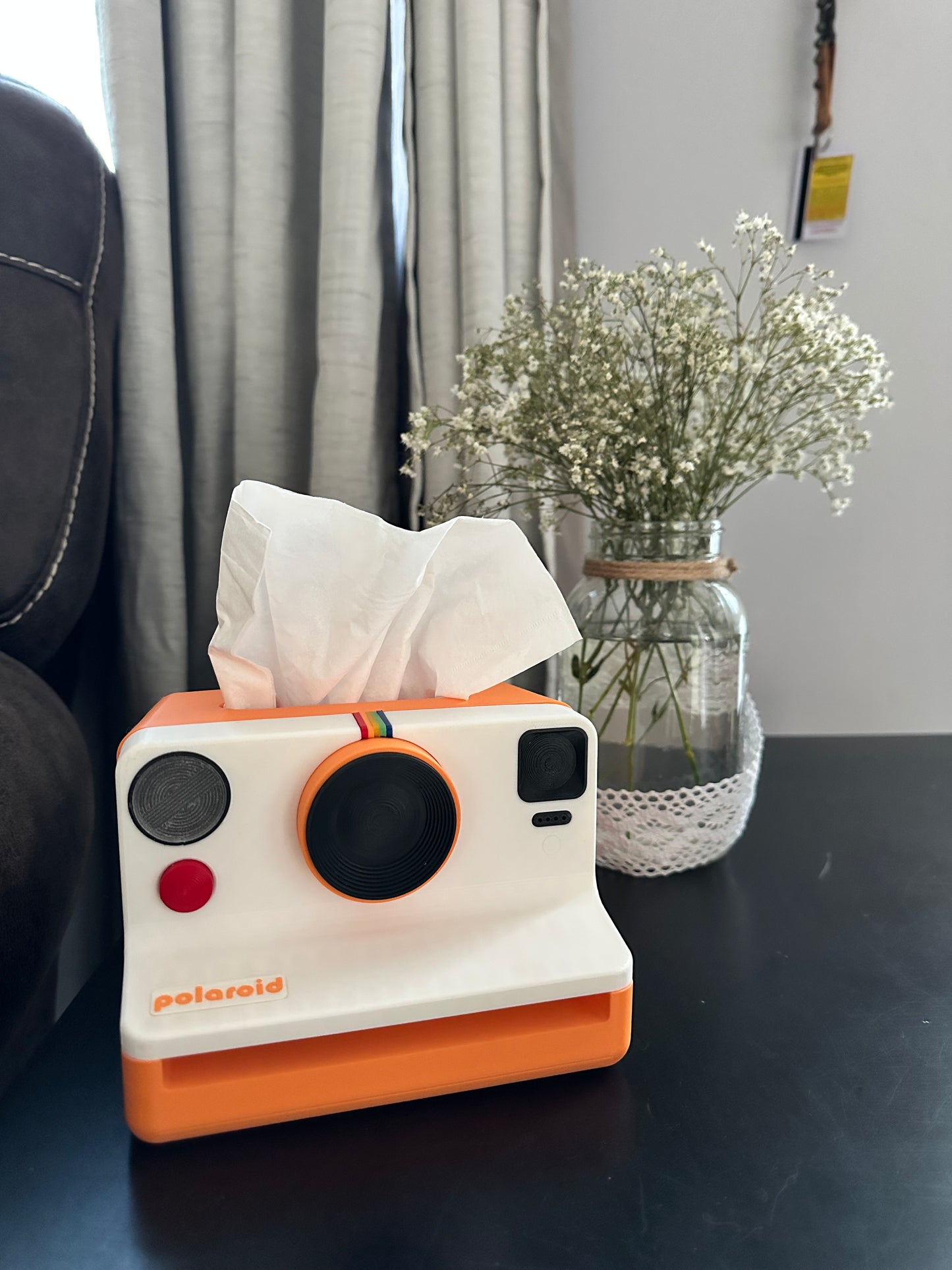 Playful and functional tissue box inspired by instant cameras