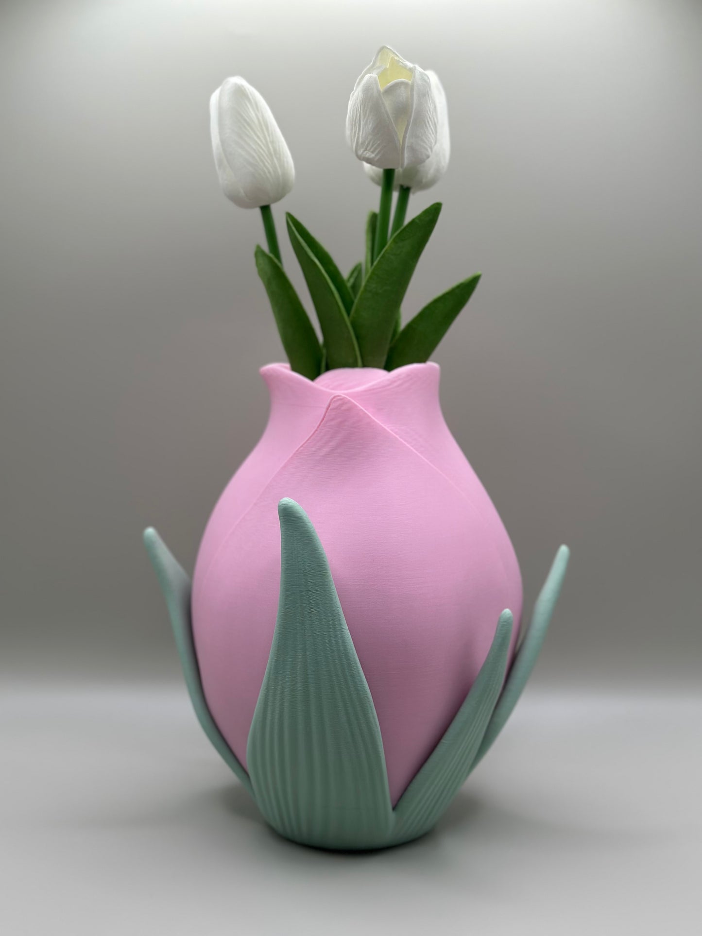 Floral-inspired modern vase holding white tulips