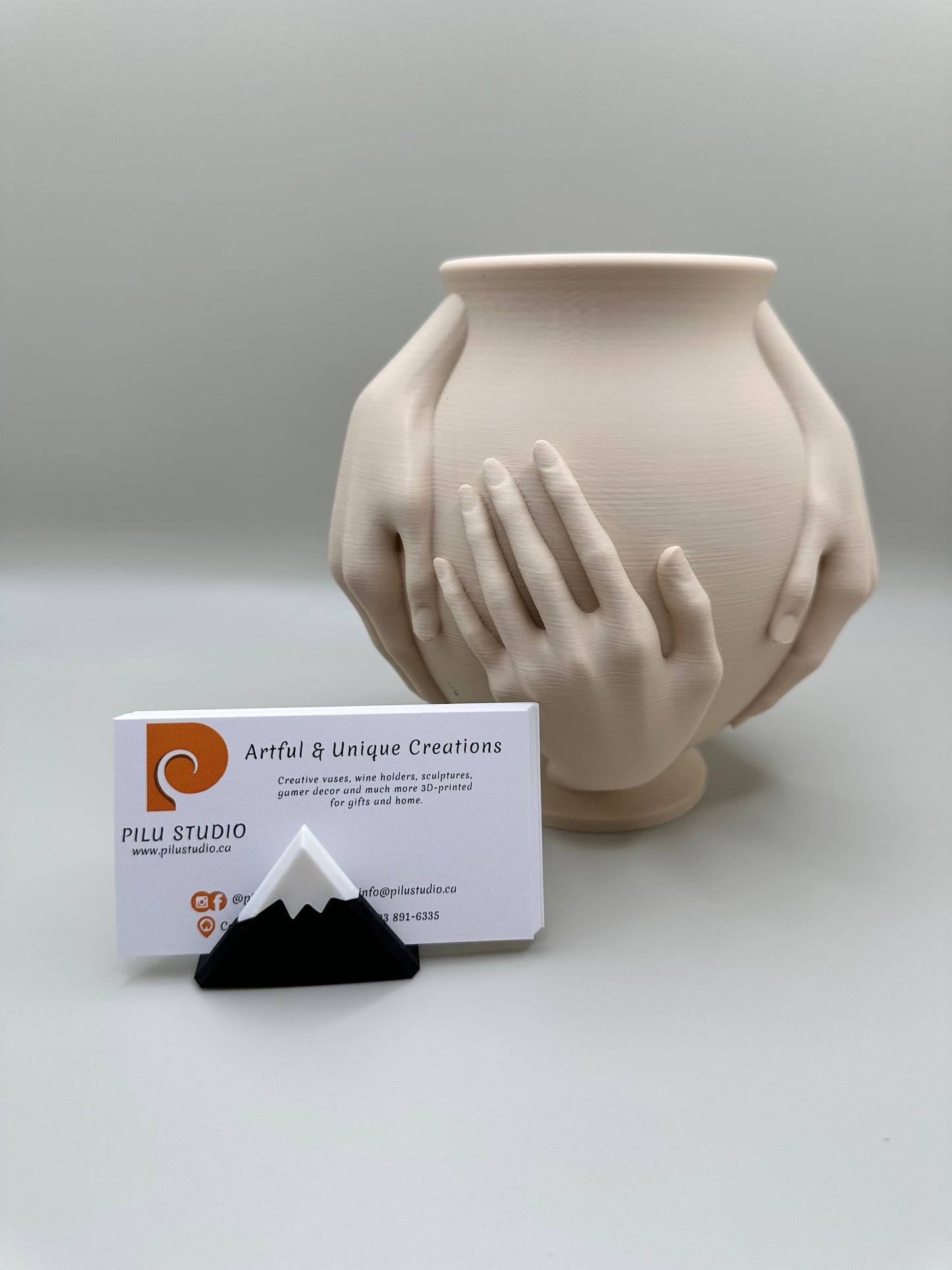 Close-up of hands vase showing intricate detail and smooth matte finish
