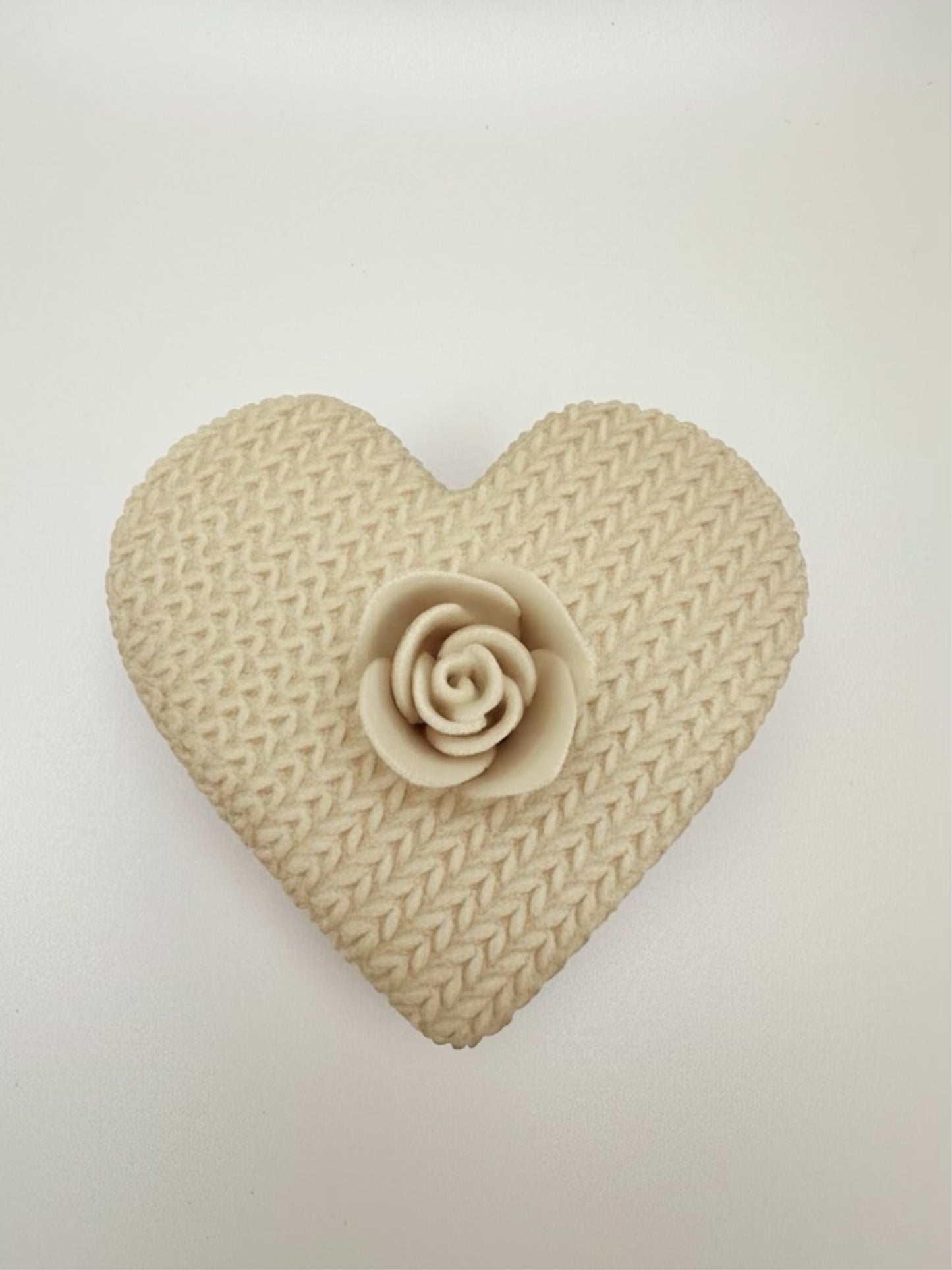 Artistic 3D printed design featuring a heart shape and intricate rose detail, symbolizing love and creativity.