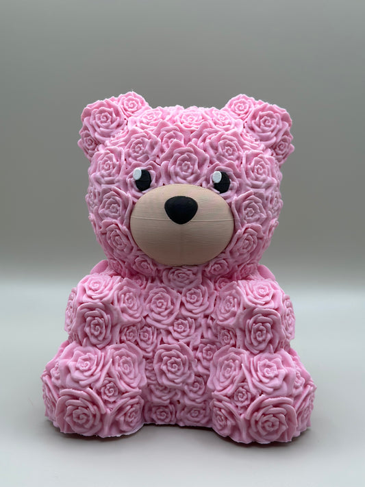 3D printed teddy bear sculpture covered in pink roses