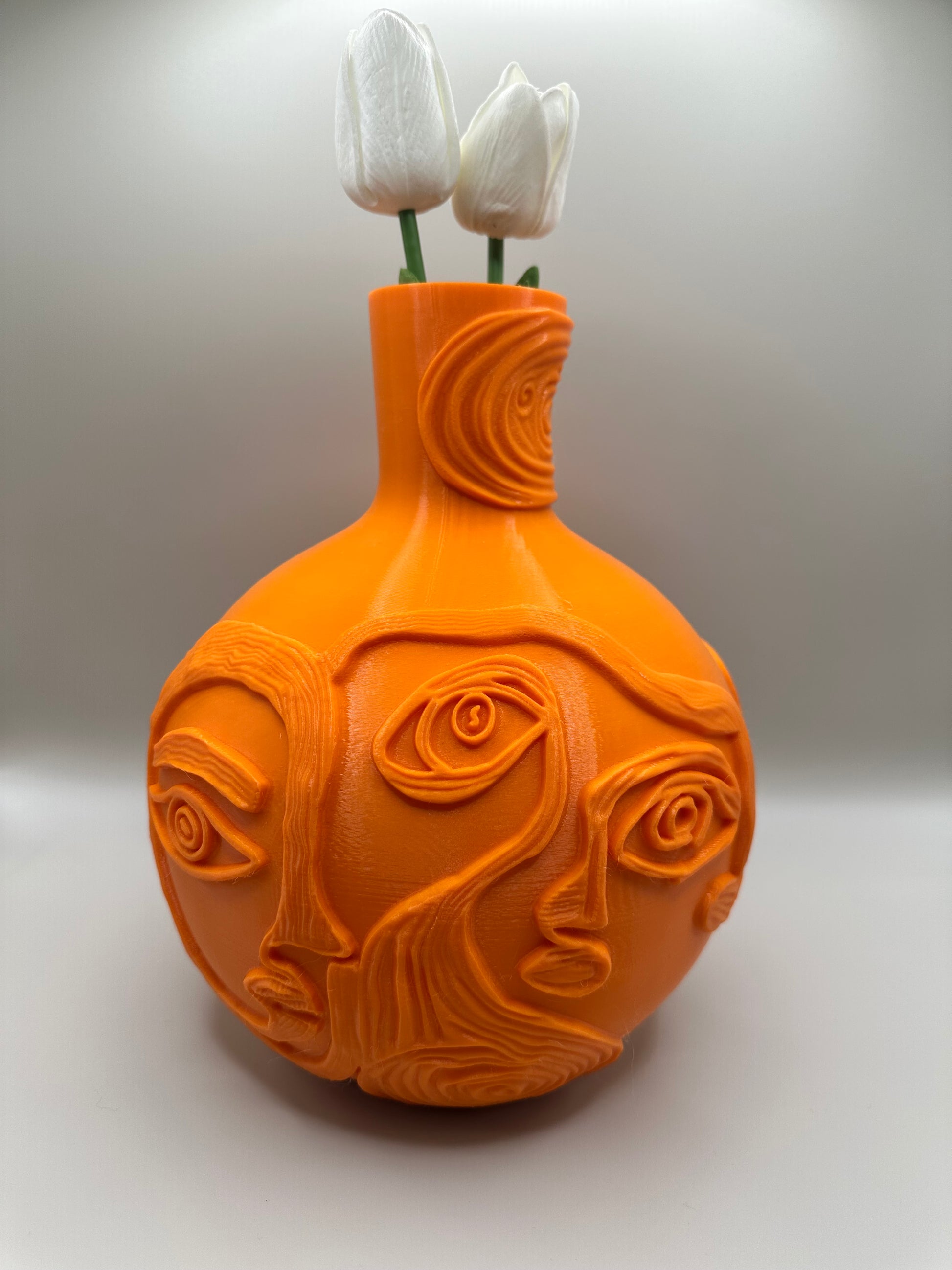 Beautiful orange faces vase