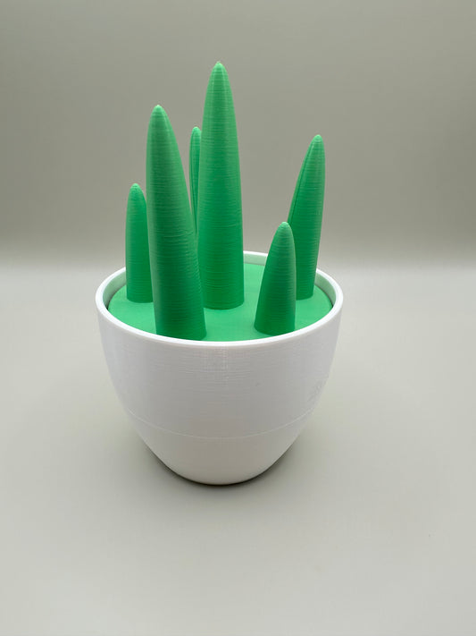 3D printed green and white jewelry holder with forest-inspired cone tops