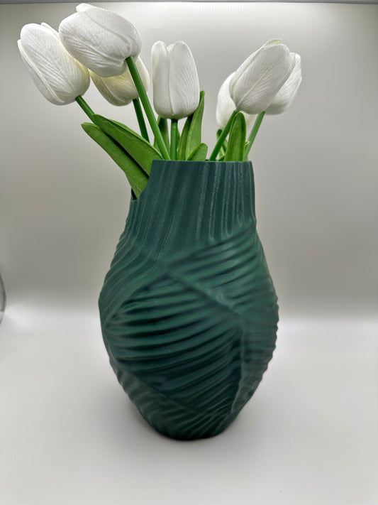 3D printed vase with twisted ridged surface, styled with tulips