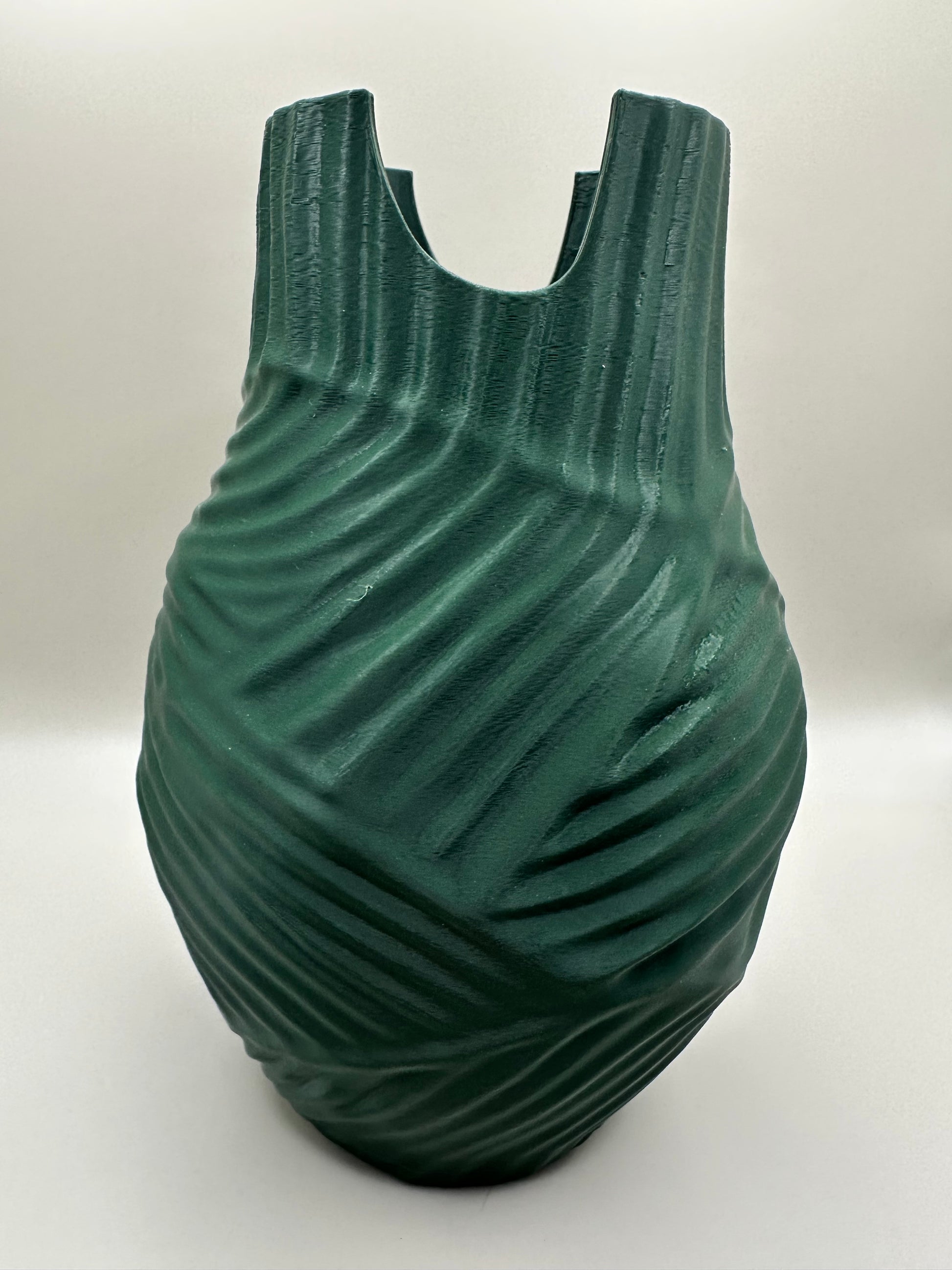 Close-up of sculptural vase with modern textured pattern