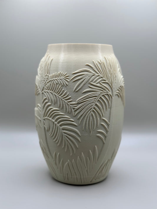 3D printed vase with embossed palm tree pattern and white tulips