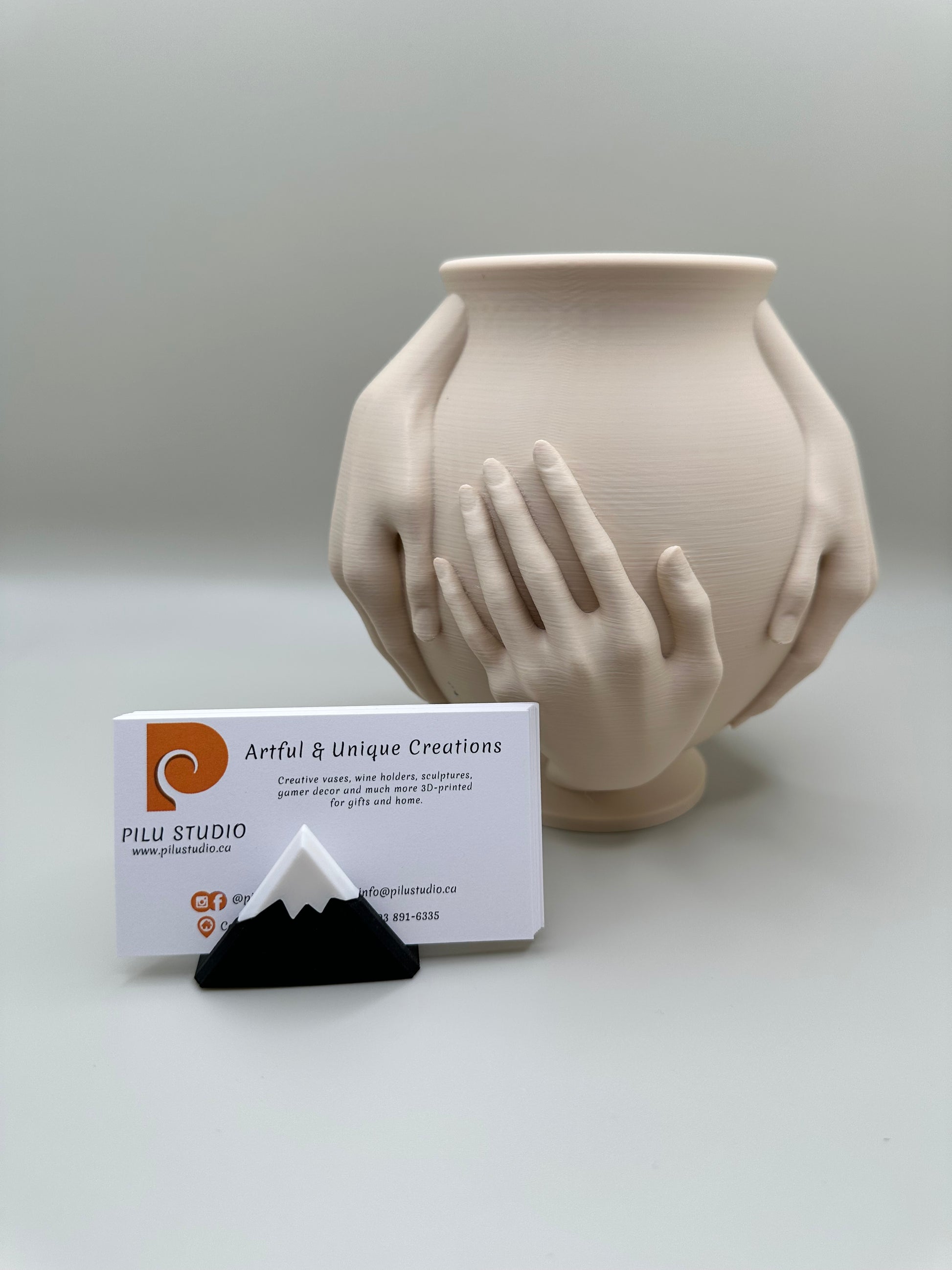 Close-up of hands vase showing intricate detail and smooth matte finish