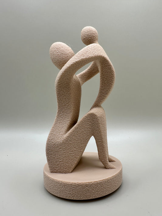 Artistic 3D printed mini sculpture representing the bond between mother and child in a modern minimalist style