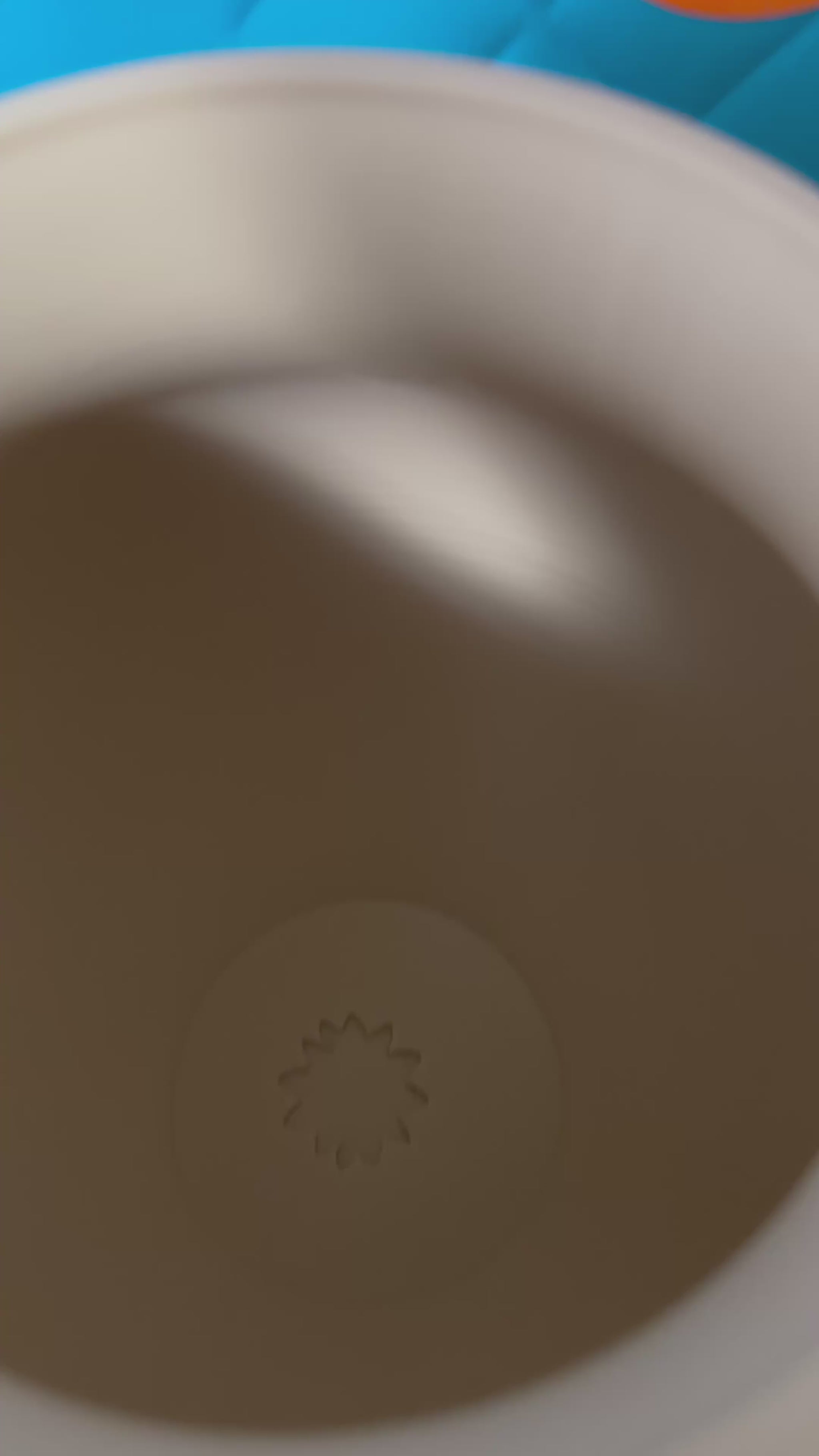 Close-up of detailed hands on 3D printed vase used as centerpiece