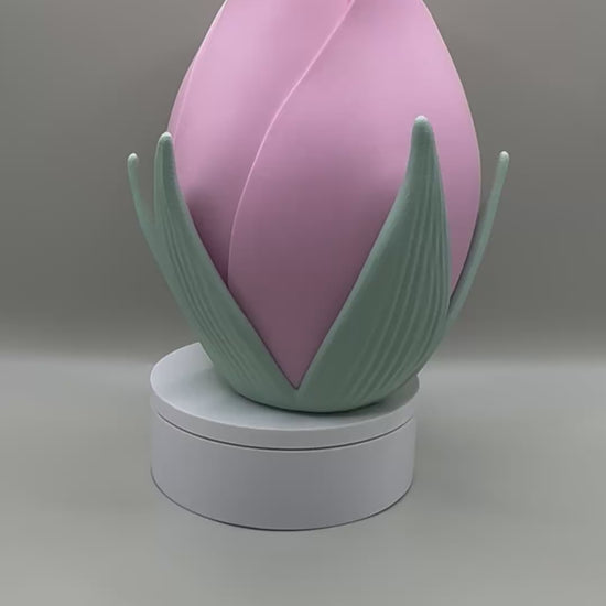 Playful decorative vase with pink and green color scheme