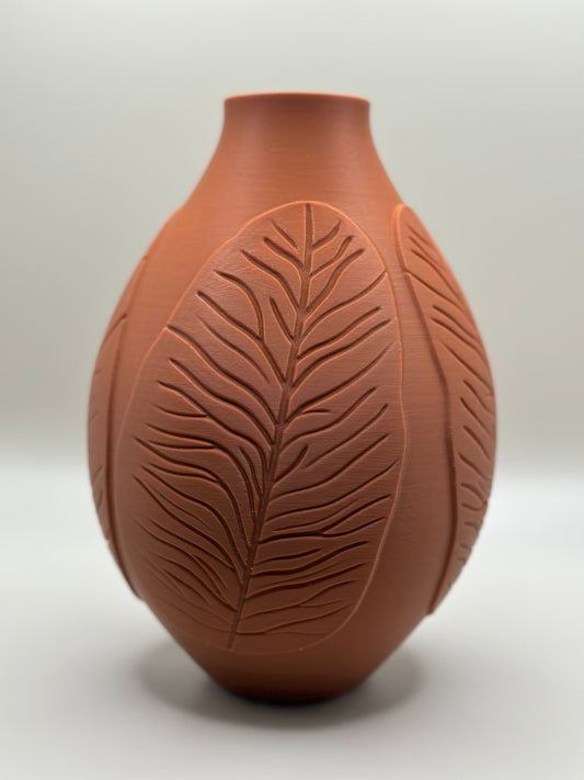3D printed vase with raised leaf pattern in terracotta color